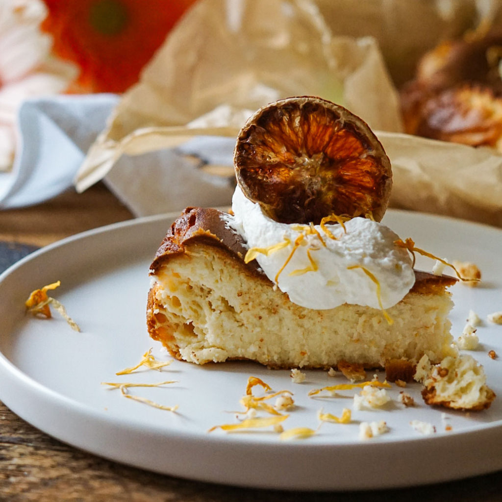 Orange Basque Cheesecake sliced on a plate